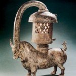 An Eastern Han dynasty copper ox lamp inlaid with silver